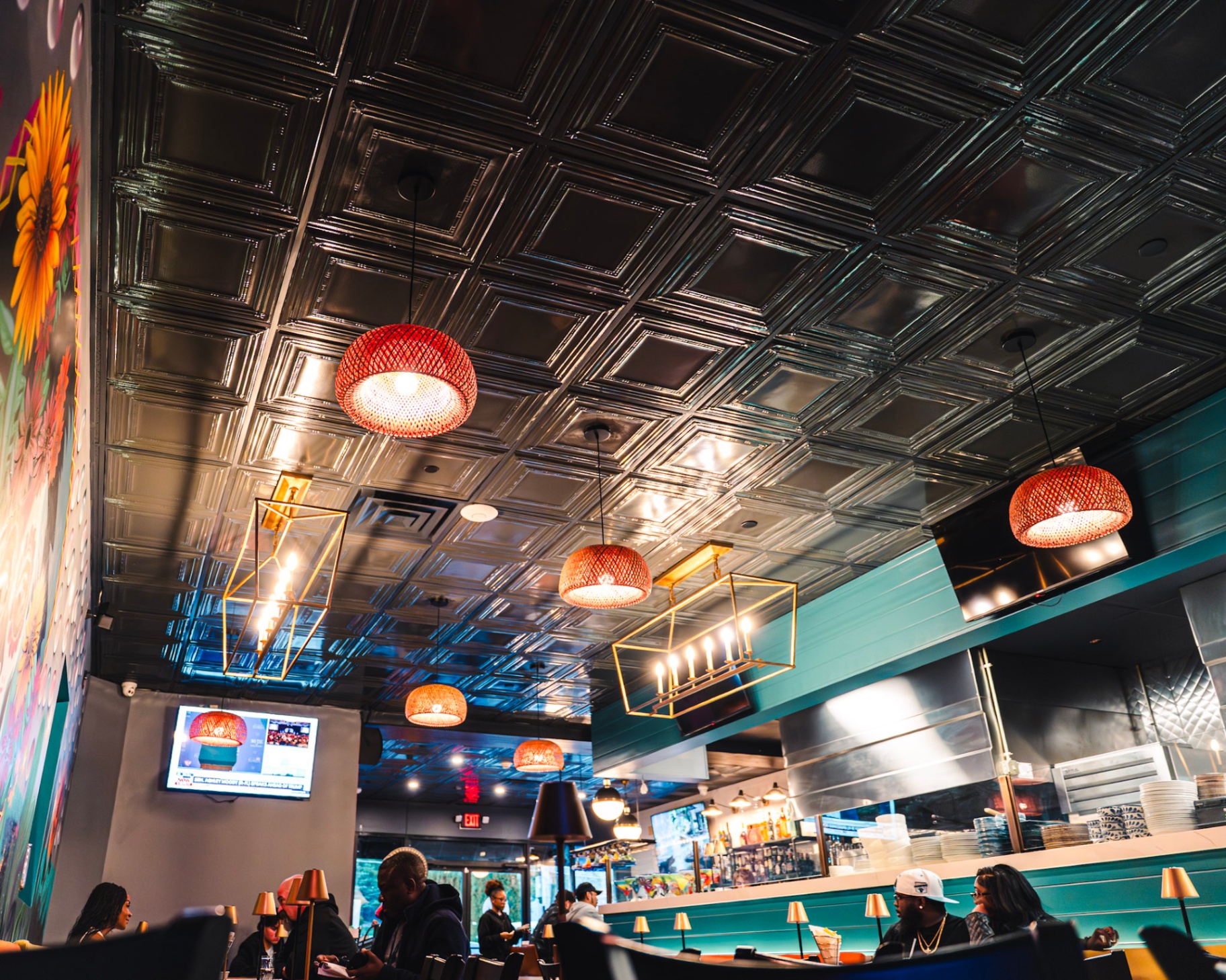 Colorful dining room with hand-painted murals at Paolo's Caribbean Fusion in Saugus
