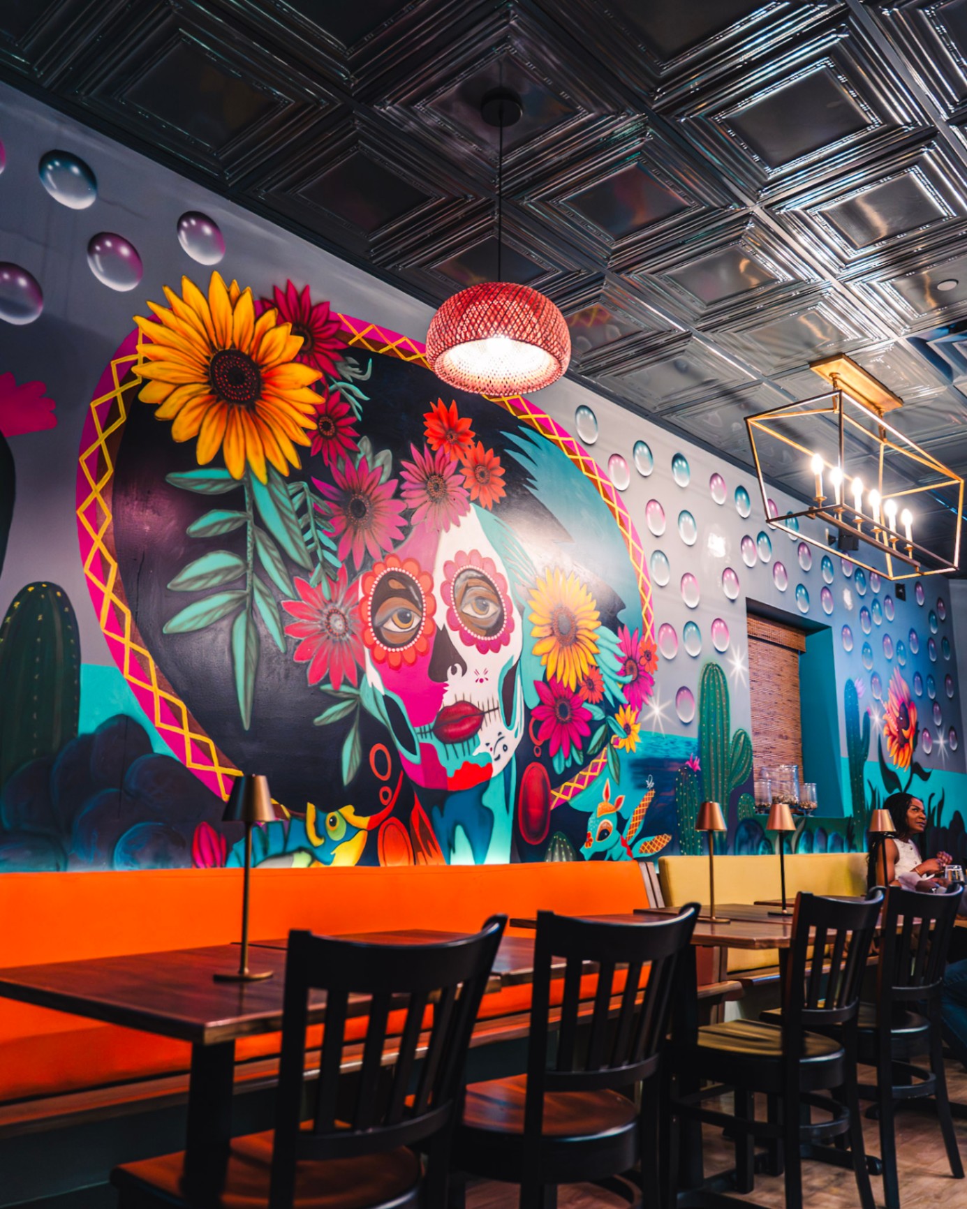 Vibrant wall art and Mexican-Haitian fusion decor